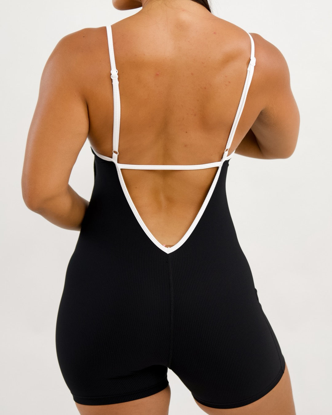 Azure V-Back Jumpsuit in Ribbed Black w/ Trim